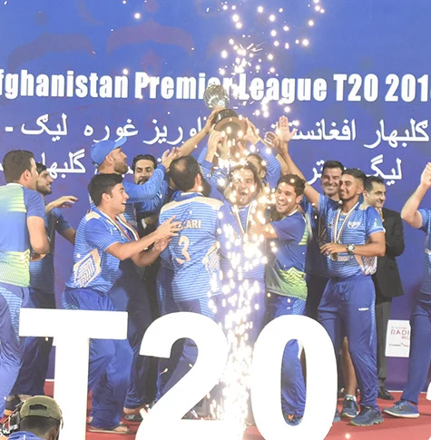 Afghan cricketers celebrating with a trophy — ACB file photo
